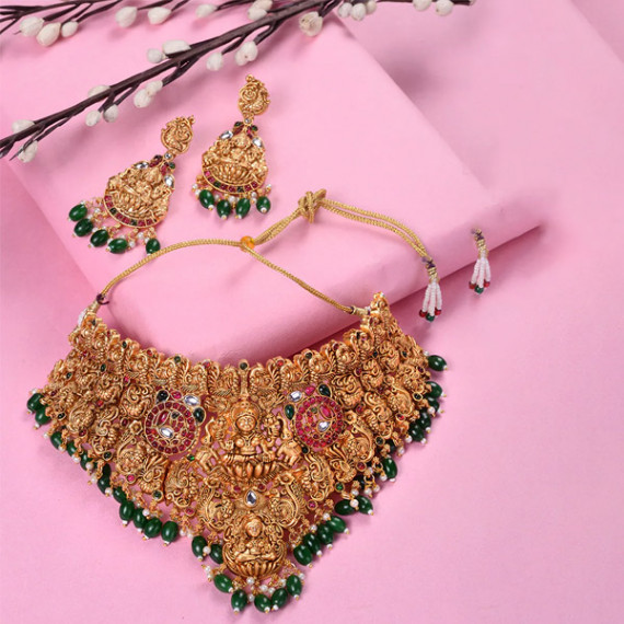 https://daiseyfashions.com/products/gold-plated-kemp-stone-studded-lakshmi-design-with-dangling-green-beads-choker-set